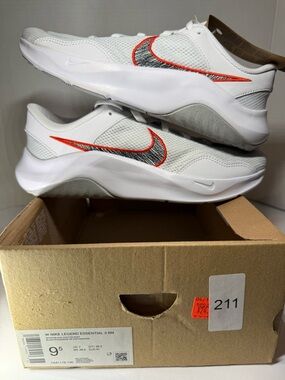 Nike Legend Essential 3White Trainers with Orange-Outlined Black Swoosh